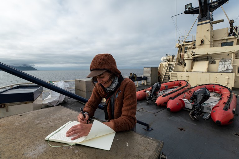 Sarah Gilman draws on a research vessel in the Bering Sea.jpg
