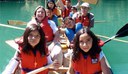 Kids in a team canoe